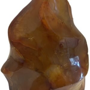 Hand carved polished carnelian flame sculpture featuring twisting ridges with deep mahogany red burnt orange tones and smoky chalcedony patches isolated on a white background